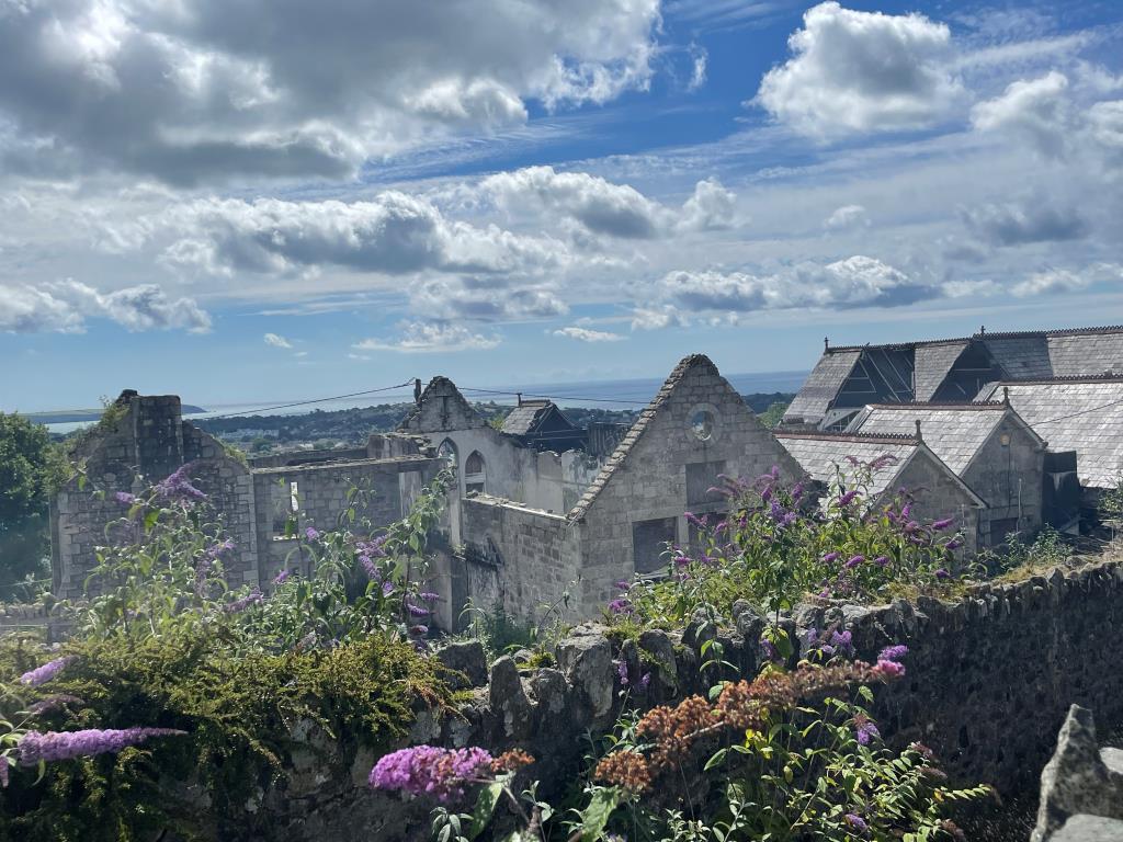 Lot: 56 - SUBSTANTIAL FORMER SCHOOL PREMISES - View from Treverbyn Road with view of the sea in the background